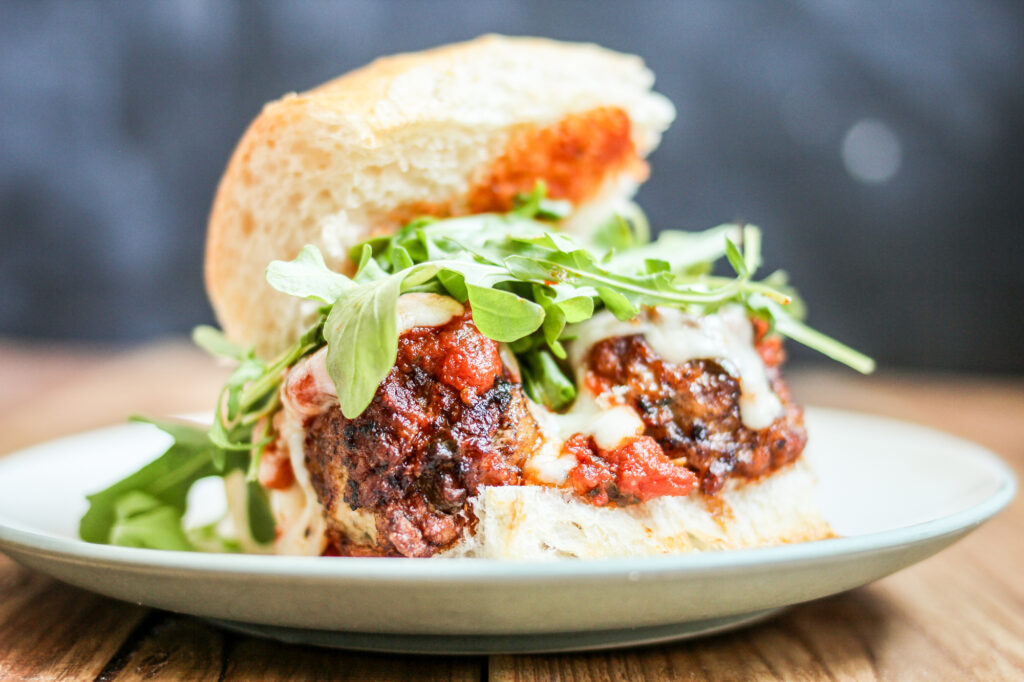 Homemade Meatball Subs with arugula