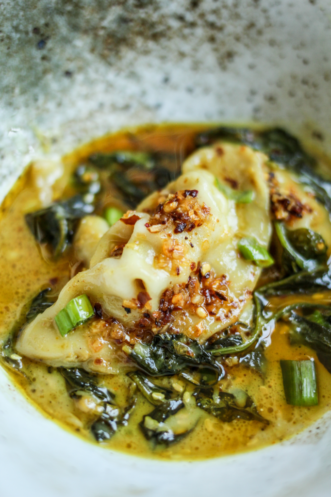 Trader Joe's Dumpling Bake in Yellow Thai Sauce in a bowl